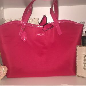 a pink LANCÔME paris purse